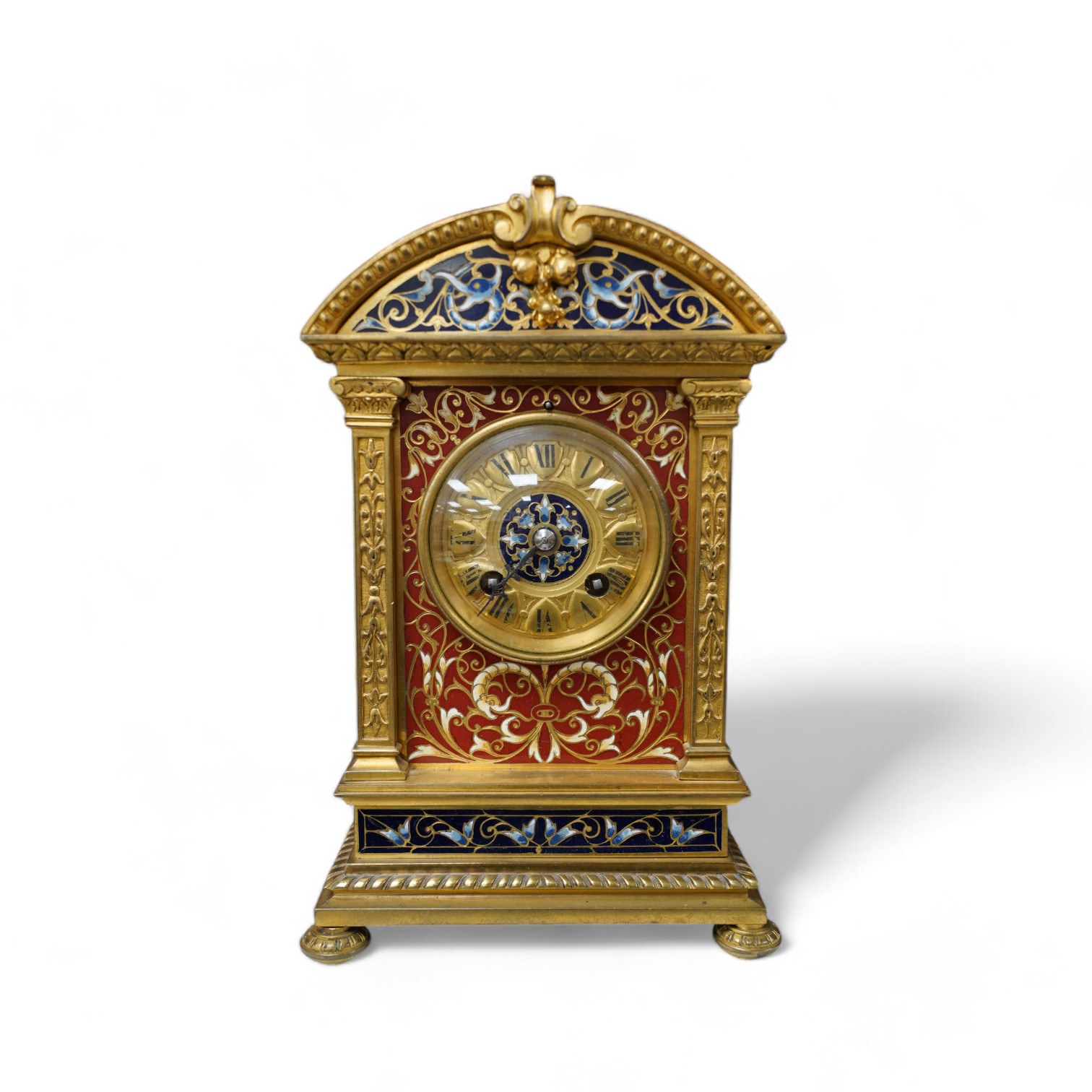 A late 19th century French champlevé enamel mantel clock, 22cm. Condition - good but with wear to dial, not tested as working